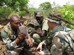 A Malian commando leader discusses his plan of attack with a member of the U.S. 3rd Special Forces Group (Airborne) prior to leading his platoon on a raid of an enemy outpost, the culmination of weeks of specialized training as part of a recent military training engagement conducted north of Bamako, Mali. Dedicated to establishing long-term relationships and developing military capacities, U.S. Special Forces conduct military training engagements throughout the Trans-Saharan region at the invitation of the Partner Nation. These training opportunities are part of Operation Enduring Freedom (Trans-Sahara), the U.S. Department of Defense initiative to promote military interoperability, and build and strengthen inter-regional cooperation in the Trans-Saharan region. The Warrior-Ambassadors of the 3rd SFG (A), highly proficient in host nation language and culture, continue their Africa-focused security forces assistance mission to enhance African Partner Nation capabilities to help achieve regional cooperation and security. The 3rd SFG (A) is based out of Fort Bragg, N.C. (Photo by Max R. Blumenfeld, JSOTF-TS PAO)