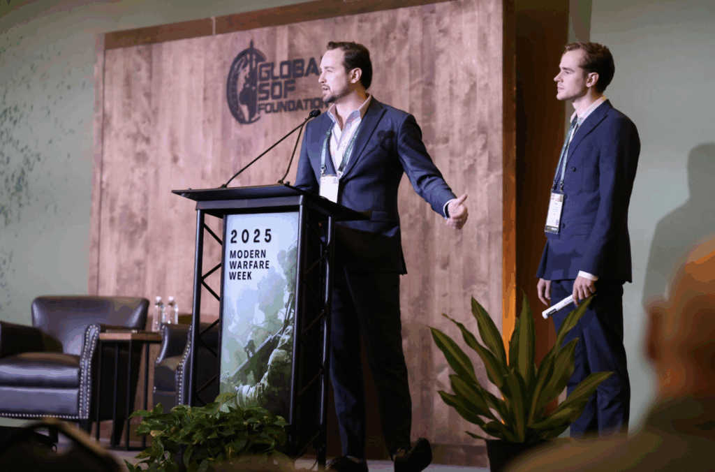 Global SOF Foundation conference speaker delivering a presentation at Modern Warfare Week 2025, focusing on military innovation and strategic defense topics with an engaged audience.